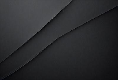 The primary subject of the image is a black background with a white line. The setting is a dark room, and the visual style is a black and white photo. The colors and mood of the image are predominantly dark and moody, with the white line providing a contrasting element.