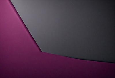 The primary subject of the image is a purple wall with a gray triangle shape on it. The setting is a room with a gray background. The visual style is a photo, and the dominant colors are purple and gray. The overall atmosphere is calm and visually appealing.