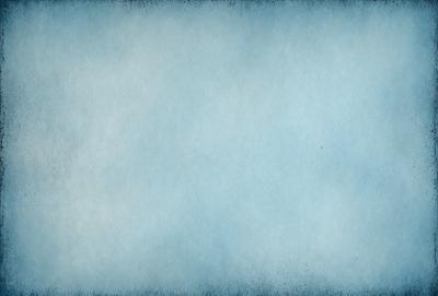The primary subject of the image is a large, blue, cloudy sky. The setting is a cloudy day, and the visual style is a photo. The colors and mood of the image are predominantly blue, creating a calm and serene atmosphere.