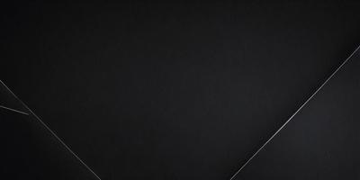 The primary subject of the image is a black background with a white line. The setting is a black surface, and the visual style is a simple, minimalist design. The colors and mood are predominantly black and white, creating a clean and modern appearance.