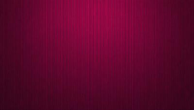 The primary subject of the image is a red wall with a patterned design. The setting is a room with a red wall, and the visual style is a close-up of the wall. The dominant colors are red and pink, creating a warm and vibrant atmosphere.