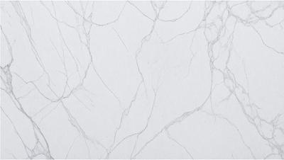 The primary subject of the image is a white marble wall with a pattern of veins. The setting is a room with a white background, and the visual style is a photo. The colors and mood of the image are predominantly white, giving it a clean and elegant appearance.