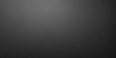 The primary subject of the image is a black background with a gray sky. The setting is a cloudy sky, and the visual style is a black and white photo. The colors and mood of the image are dark and moody, creating a dramatic atmosphere.