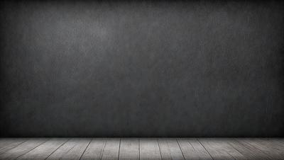 The primary subject of the image is a large, empty, and grey wall. The setting is a room with a wooden floor. The visual style is a photo, and the colors and mood are predominantly grey and empty.