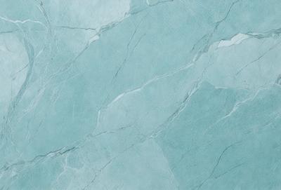 The primary subject of the image is a blue marble wall with a pattern of white and blue swirls. The setting is a bathroom, and the visual style is a photo. The dominant colors are blue and white, creating a calm and soothing atmosphere.