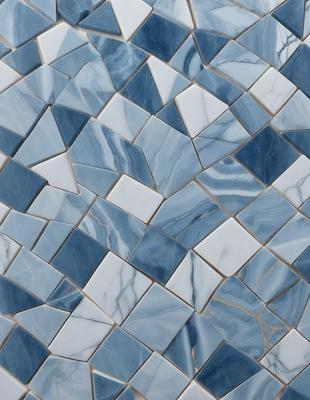 The primary subject of the image is a blue and white marble tile wall. The setting is a room with a blue and white marble tile floor. The visual style is a close-up of the tile wall, showcasing the intricate design and patterns. The colors and mood of the image are predominantly blue and white, creating a clean and elegant atmosphere.