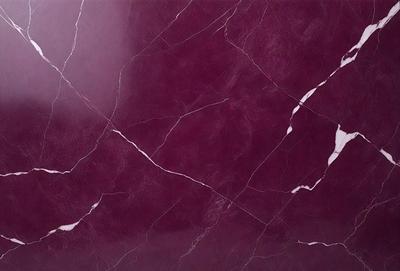 The primary subject of the image is a marble countertop with a purple hue. The setting is a kitchen, and the visual style is a close-up of the marble countertop. The colors and mood of the image are predominantly purple, giving it a luxurious and elegant appearance.