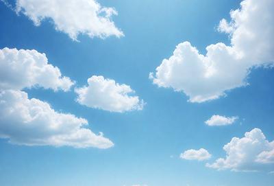 The primary subject of the image is a beautiful blue sky filled with fluffy white clouds. The setting is a clear day with a bright blue sky, and the visual style is a natural, outdoor scene. The colors and mood of the image are serene and peaceful, with the blue sky and white clouds creating a calming atmosphere.