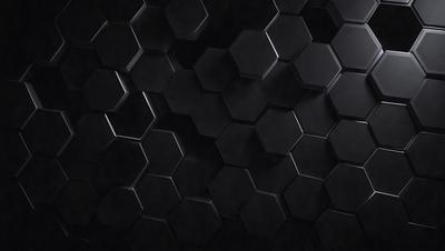 The primary subject of the image is a black and white patterned wall. The setting is a dark room with a black background. The visual style is a close-up of the patterned wall, which gives a sense of depth and texture. The dominant colors are black and white, creating a moody and dramatic atmosphere.
