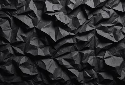 The primary subject of the image is a black wall with a pattern of black and white triangles. The setting is a dark room, and the visual style appears to be a digital art or illustration. The dominant colors are black and white, creating a bold and striking pattern on the wall.