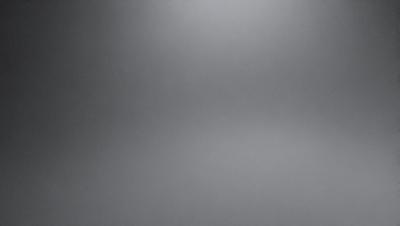The image is a grayscale photo of a wall, with a large portion of the wall being covered in a gray texture. The wall appears to be made of concrete, and the photo captures the texture and details of the wall. The grayscale effect gives the image a more dramatic and artistic feel.
