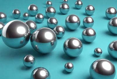 The primary subject of the image is a collection of silver or metallic balls, which are the main objects in the scene. The setting is a blue background, which provides a contrasting color to the balls. The visual style of the image is a close-up of the balls, showcasing their metallic appearance. The colors and mood of the image are predominantly silver and metallic, giving it a sleek and modern feel.