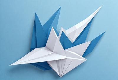 The primary subject of the image is a collection of origami paper cranes. There are five cranes in total, with each crane having a different color and design. The setting is a blue surface, which serves as the background for the origami cranes. The visual style of the image is a combination of photo and digital art, as it captures the intricate details of the paper cranes. The colors and mood of the image are vibrant and cheerful, with the blue surface adding a sense