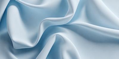 The primary subject of the image is a white sheet of fabric, which is the main object in the scene. The setting is a blue background, which creates a contrasting and visually appealing environment. The visual style of the image is a close-up of the fabric, showcasing its texture and details. The colors and mood of the image are predominantly white and blue, giving it a clean and serene atmosphere.