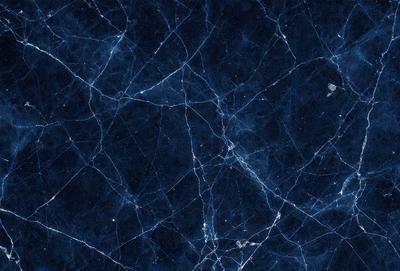 The primary subject of the image is a blue marble wall with a pattern of white veins. The setting is a room with a blue background, and the visual style is a close-up of the marble wall. The colors and mood of the image are predominantly blue, with the white veins adding a contrasting element to the overall atmosphere.