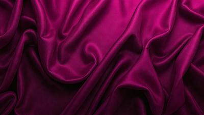 The primary subject of the image is a purple fabric, which is the main object, scene, or focus of the image. The setting or background is a purple cloth, and the visual style is a photo. The colors and mood of the image are predominantly purple, creating a calm and soothing atmosphere.