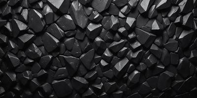 The primary subject of the image is a large black rock wall. The setting is a dark room, and the visual style is a black and white photo. The dominant colors are black and white, creating a moody atmosphere.