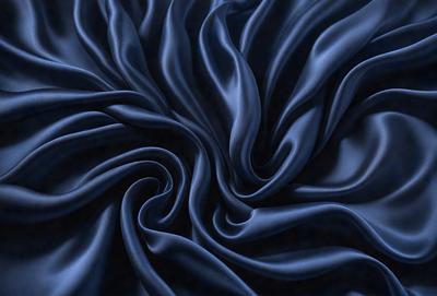 The primary subject of the image is a blue fabric, which appears to be a piece of cloth or a curtain. The setting is a dark background, which contrasts with the blue fabric. The visual style is a close-up of the blue fabric, showcasing its texture and pattern. The colors and mood of the image are predominantly dark and moody, with the blue fabric being the main focal point.