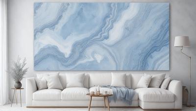 The primary subject of the image is a large, blue, marbled wallpaper that covers the entire wall. The setting is a living room with a couch and a coffee table. The visual style is a realistic representation of the wallpaper, and the colors and mood are predominantly blue, creating a calm and serene atmosphere.