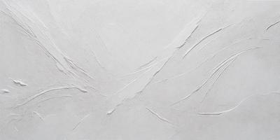 The image features a white wall with a pattern of white and grey streaks. The wall appears to be textured, giving it a unique and interesting appearance. The primary subject of the image is the white wall, which serves as the main focus of the scene.