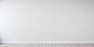 The primary subject of the image is a white wall with a large, empty space. The setting is a room with a wooden floor. The visual style is a photo, and the colors and mood are predominantly white, giving the image a clean and minimalist appearance.