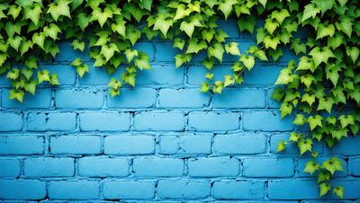 The primary subject of the image is a blue brick wall with green ivy growing on it. The setting is an outdoor environment, and the visual style is a photo. The dominant colors are blue and green, creating a calm and serene atmosphere.
