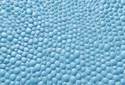 The primary subject of the image is a blue background with a pattern of small bubbles or spheres. The setting appears to be a blue ocean or a deep blue sky. The visual style of the image is a close-up of the blue background, showcasing the intricate pattern of the bubbles. The colors and mood of the image are predominantly blue, creating a serene and calming atmosphere.