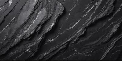 The primary subject of the image is a large, dark gray rock with a rough, textured surface. The rock is the main object, scene, or focus of the image. The setting or background consists of a black and white photograph, which gives the image a classic and timeless appearance. The visual style is a black and white photograph, which adds a sense of depth and contrast to the image. The colors and mood of the image are predominantly dark and moody, with the rock's rough texture and the black and white