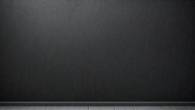 The primary subject of the image is a large, dark grey wall. The setting is a room with a wooden floor. The visual style is a photo, and the dominant colors are grey and black. The overall atmosphere is somewhat moody and dramatic.