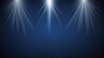 The primary subject of the image is a blue background with a pattern of bright lights, creating a visually striking and dramatic scene. The setting appears to be a stage or a performance area, as the lights are arranged in a way that highlights the background. The visual style of the image is a combination of digital art and illustration, as the lights are depicted in a way that resembles a painting or drawing. The colors and mood of the image are predominantly blue, with the bright lights adding a sense of energy