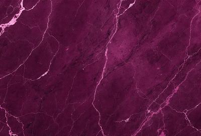 The primary subject of the image is a purple marble wall. The setting is a room with a purple marble wall as the main focus. The visual style is a close-up of the marble wall, showcasing its texture and color. The colors and mood of the image are predominantly purple, creating a calm and elegant atmosphere.