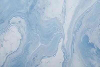 The primary subject of the image is a blue and white marble tile. The setting is a bathroom, as indicated by the presence of the marble tile. The visual style is a close-up of the tile, showcasing its intricate design and texture. The dominant colors are blue and white, creating a clean and elegant atmosphere in the bathroom.