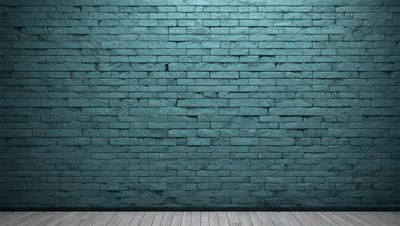 The primary subject of the image is a blue brick wall. The setting is a room with a wooden floor. The visual style is a photo, and the dominant colors are blue and grey. The overall atmosphere is calm and serene.
