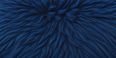The primary subject of the image is a blue, furry, and textured surface. The setting is a close-up of the blue material, which appears to be a knitted or woven fabric. The visual style is a detailed, up-close view of the blue material, showcasing its unique texture and color. The colors and mood of the image are predominantly blue, creating a calm and soothing atmosphere.