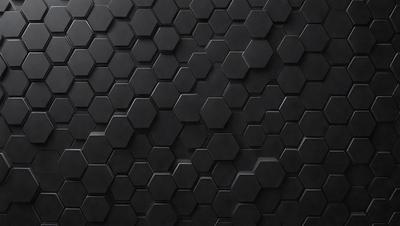 The primary subject of the image is a black and white patterned surface, which appears to be a black tile or a black and white checkered pattern. The setting is a dark background, which contrasts with the patterned surface. The visual style is a close-up of the pattern, showcasing the intricate details of the design. The colors and mood of the image are predominantly dark and moody, with the black and white pattern creating a sense of depth and contrast.