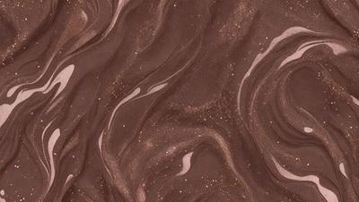 The primary subject of the image is a close-up of a brown and gold patterned surface, which appears to be a textured wall or a piece of fabric. The setting is a room with a brown and gold color scheme. The visual style is a close-up of the pattern, which gives a sense of depth and intricacy to the design. The colors and mood of the image are warm and inviting, with the brown and gold tones creating a cozy and comfortable atmosphere.
