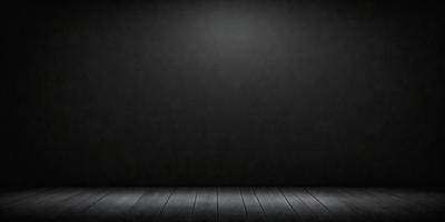 The primary subject of the image is a wooden floor with a black background. The setting is a room with a black wall, and the visual style is a black and white photo. The colors and mood of the image are predominantly dark and moody, creating a dramatic atmosphere.