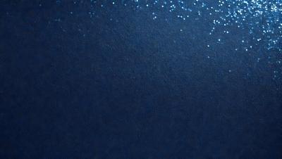 The primary subject of the image is a blue background with a few white specks. The setting appears to be a dark, possibly underwater, environment. The visual style is a combination of a photo and a drawing, creating a unique and artistic appearance. The colors and mood of the image are predominantly dark and moody, with the blue background and white specks adding a touch of contrast and interest.