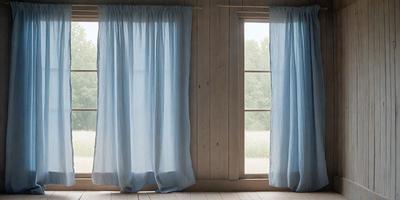 The primary subject of the image is a pair of blue curtains hanging in front of a window. The setting is a room with a wooden wall, and the visual style appears to be a photo. The curtains are the main focus of the image, and the overall atmosphere is calm and serene.