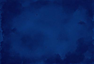 The primary subject of the image is a blue sky with clouds. The setting is a cloudy sky, and the visual style is a photo. The dominant colors are blue and white, creating a calm and serene atmosphere.