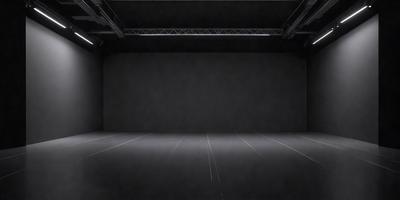 The primary subject of the image is a large, dark room with a black wall. The setting is a black stage, and the visual style is a black and white photo. The room appears to be empty and has a somewhat eerie atmosphere.