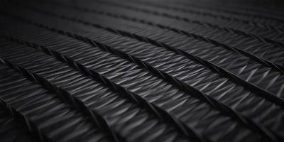 The primary subject of the image is a black and gray patterned surface, which appears to be a textured fabric or a black and gray carpet. The setting is a dark room, and the visual style is a close-up of the patterned surface. The colors and mood of the image are predominantly dark and moody, with the black and gray pattern creating a sense of depth and intricacy.