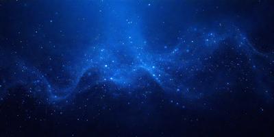 The primary subject of the image is a blue sky filled with stars. The setting is a dark, star-filled sky, and the visual style is a photo. The colors and mood of the image are predominantly dark and moody, with the blue sky and stars creating a sense of depth and mystery.