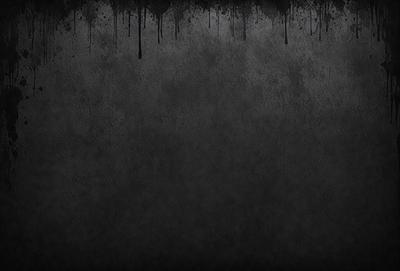 The primary subject of the image is a black and white photo of a wall. The setting is a gray wall, and the visual style is a black and white photo. The colors and mood of the image are predominantly dark and moody, with the gray wall and black and white photo creating a sense of depth and contrast.