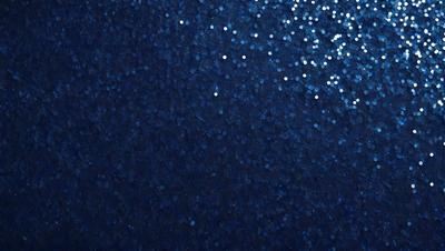 The primary subject of the image is a blue background with a pattern of white stars. The setting appears to be a night sky, and the visual style is a combination of a photo and digital art. The dominant colors are blue and white, creating a serene and peaceful atmosphere.