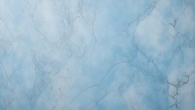 The primary subject of the image is a marble wall with a blue tint. The setting is a room with a blue background. The visual style is a close-up of the marble wall, showcasing its texture and color. The colors and mood of the image are predominantly blue, creating a calm and serene atmosphere.