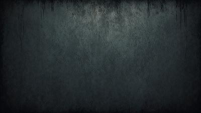 The primary subject of the image is a large, dark grey wall with a textured surface. The setting is a room with a grey background, and the visual style appears to be a photo. The dominant colors in the image are grey, and the overall atmosphere is somewhat moody and dramatic.