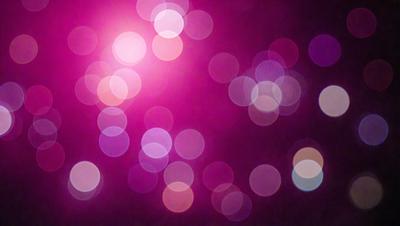 The primary subject of the image is a bright pink background with a purple hue. The setting is a dark background, which contrasts with the bright colors of the pink and purple. The visual style appears to be a digital art or illustration, as the colors and patterns are vibrant and eye-catching. The dominant colors are pink and purple, creating a warm and inviting atmosphere.