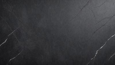 The primary subject of the image is a black leather wall. The setting is a black wall, and the visual style is a photo. The colors and mood of the image are dark and moody, with the black leather wall being the main focus.