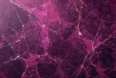 The primary subject of the image is a purple marbled wall. The setting is a room with a purple marbled wall as the main focus. The visual style is a close-up of the marbled wall, showcasing its unique texture and pattern. The colors and mood of the image are predominantly purple, creating a calm and soothing atmosphere.